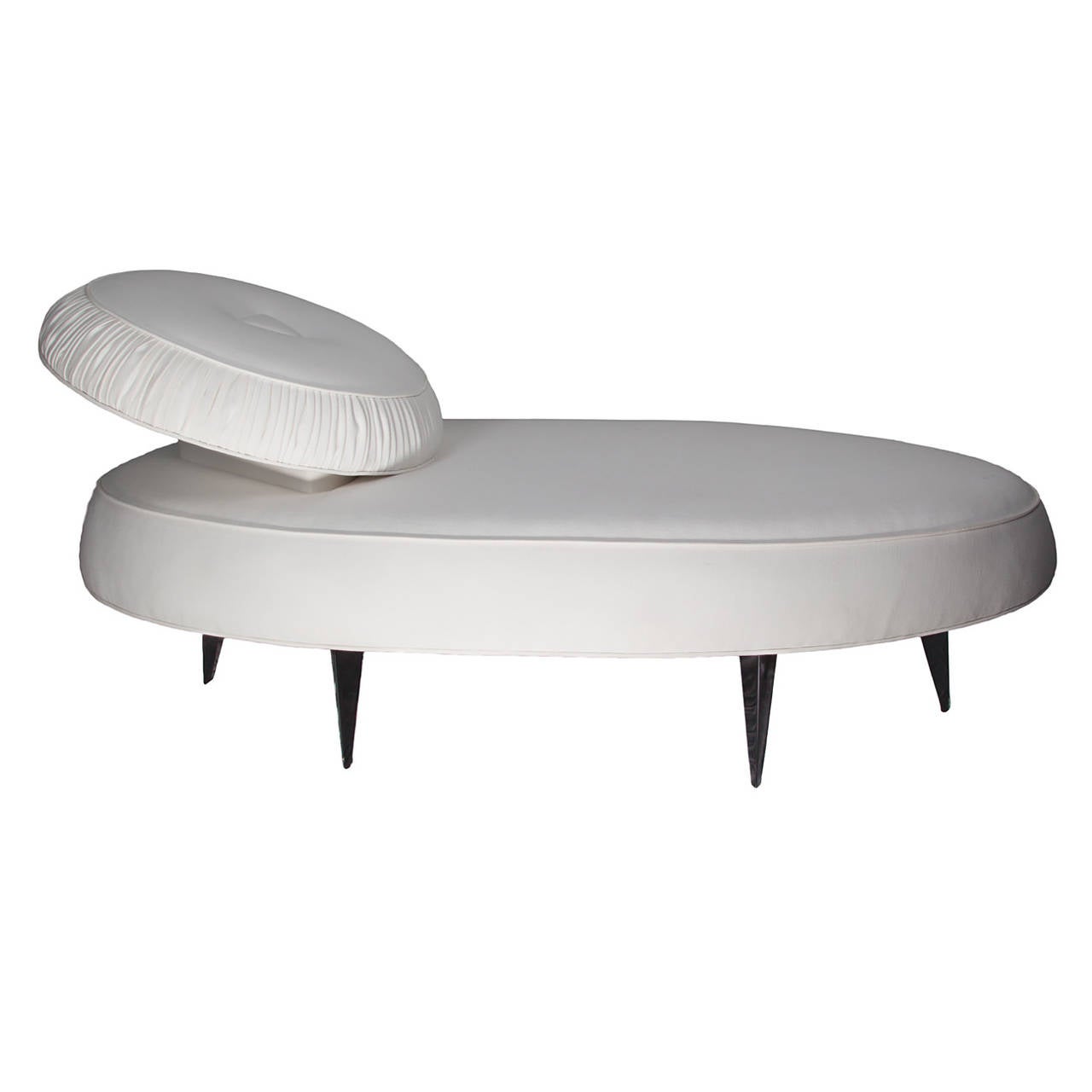 A highly unusual Art Deco chaise featuring black lacquer tapered wood legs and a raised pleated headrest. An elliptical shape combined with the articulated headrest makes this piece a rare find. Newly refinished and re-upholstered in an ivory cotton