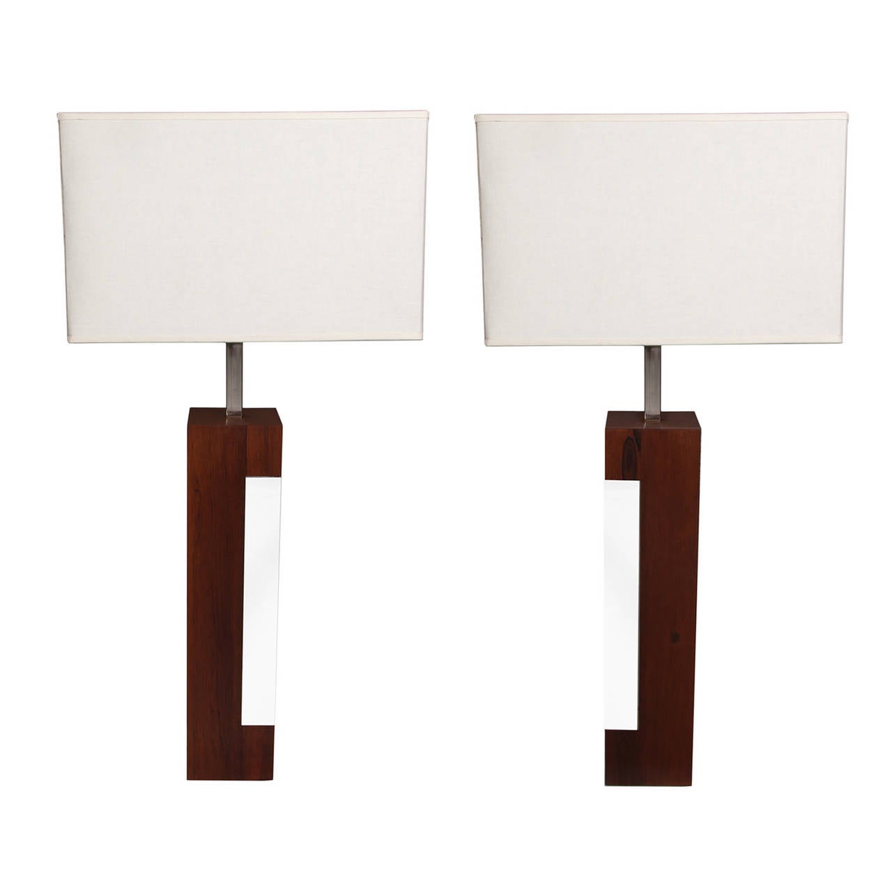 A pair of Mid-Century chrome banded walnut lamps with white linen shades. Height dimension is to the top of finial.