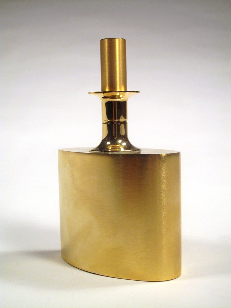 This 24-karat gold-plated decanter is truly unique in its design. Made by Pierre Forssell for Skultuna, Sweden. Polished and brushed finish.