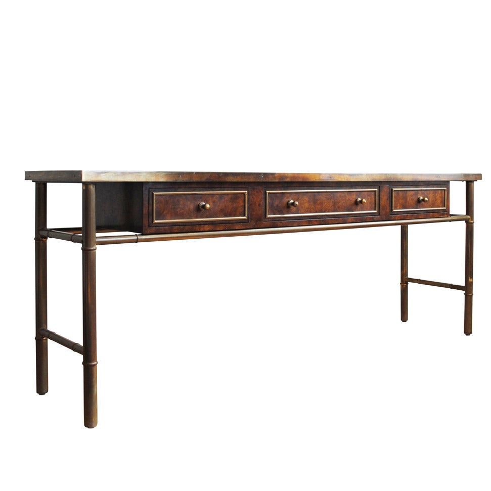 A beautiful Mastercraft patinated brass and Amboyna burl wood three-drawer console with an etched top. Lovely patina to the brass.