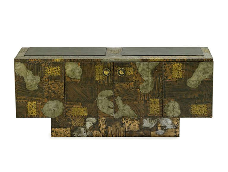 A stunning example of Paul Evans' Patchwork series for Directional. This studio piece by Paul Evans exemplifies the perfect melding of modernist design and superior metal craftmanship. The 4-door Patchwork cabinet is constructed of patinated copper,