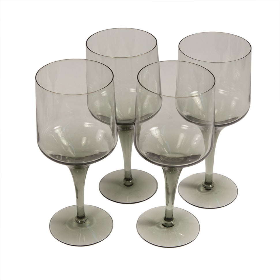 Set of 4 Smoky Grey Cocktail Glasses by Sven Palmqvist for Orrefors. 2 sets of 4 wine glasses are available.