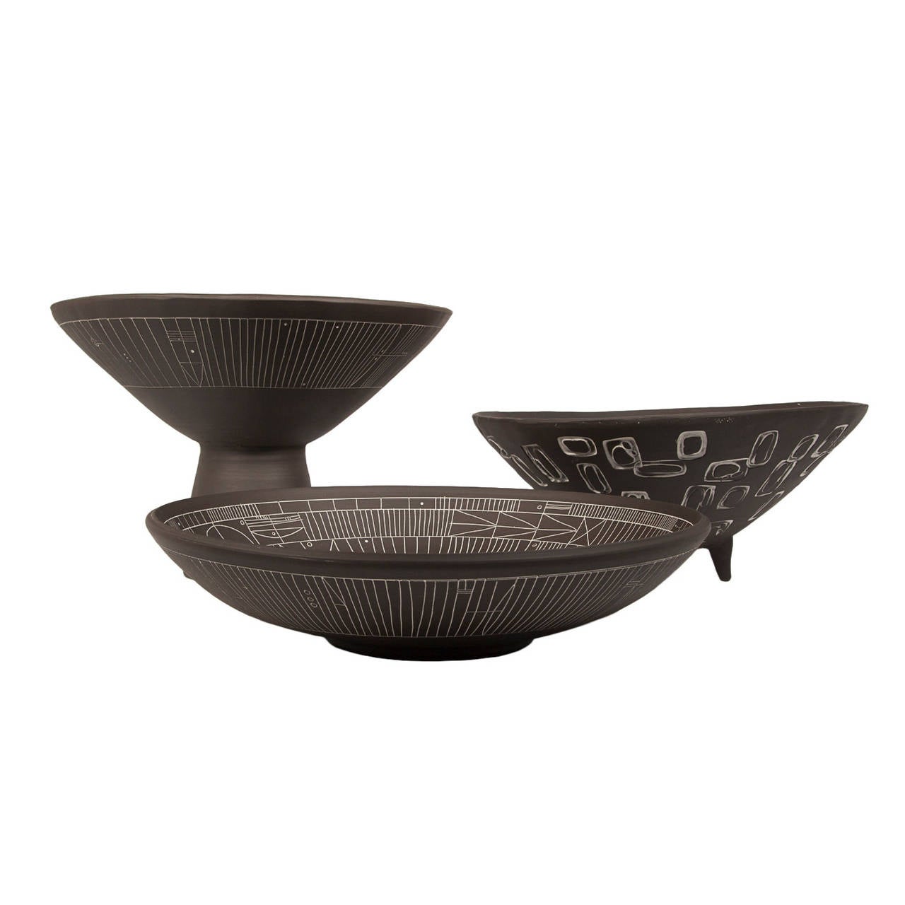 A trio of large incised black and white “Scribe” ceramic bowls by LA artist Heather Rosenman. Individually carved, so no two are alike. Decorative purpose only. Signed by the artist. Can be purchase individually.

Measures: Pedestal bowl (Left):
