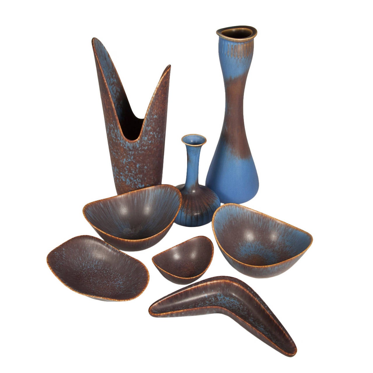A great collection of Gunnar Nylund ceramics for Rorstrand with a stunning blue/brown haresfur glaze. Can be purchased individually. Maker's mark and signature on bottom. One of the larger bowls has been sold (see below).

Vase (left): 5