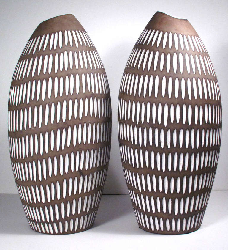 A striking brown and off-white pair of Ingrid Atterberg ceramic floor vases for Upsala Ekeby. Impressed with maker's mark. Can be purchased individually.