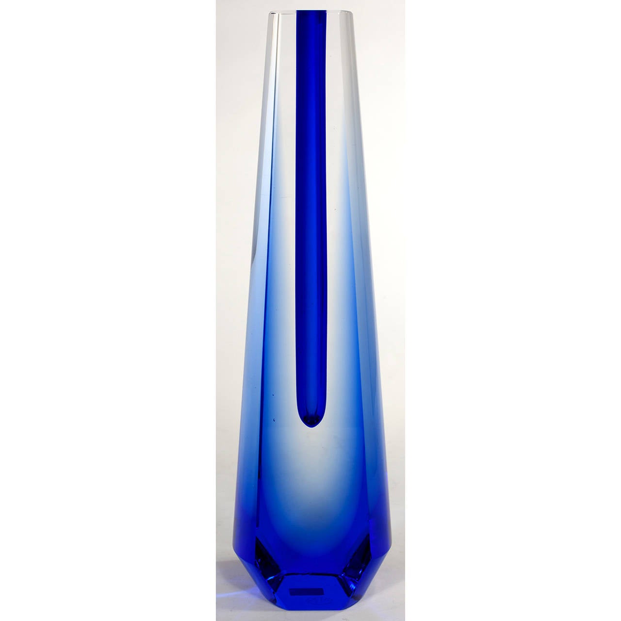 A sculptural glass vase by Pavel Hlava. An deep blue teardrop is suspended in a blue and clear glass form. The inner tubular core can be used as a vase, but this is more of a sculpture. Maker's mark on bottom.
