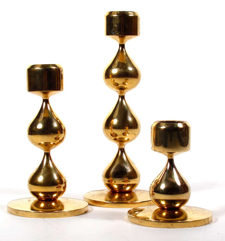 A terrific trio of Hugo Asmussen 24K gold-plated candle holders.
Large: 9.75