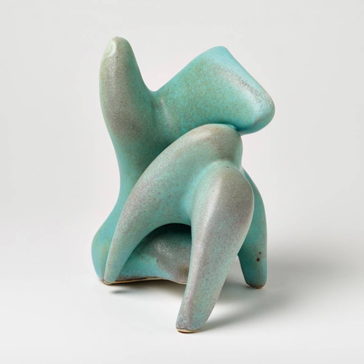 An elegant porcelain sculpture by Tim and Jacqueline Orr with turquoise blue glaze decoration.
Signed at the base 