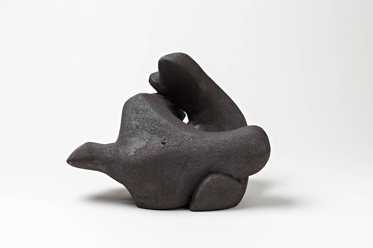 A ceramic sculpture by Tim Orr with black englobe decoration.
Signed under the base 