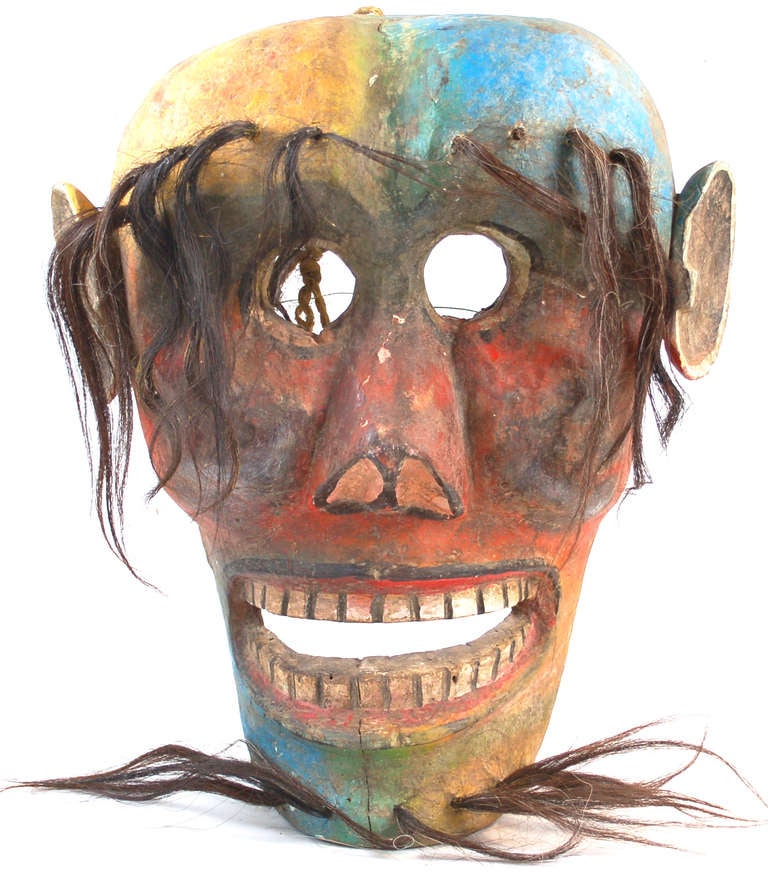Amazing example of true Folk Art, this is a huge carved mask painted in multiple colors and adorned with horse hair.  This piece probably was made in Guerrero.