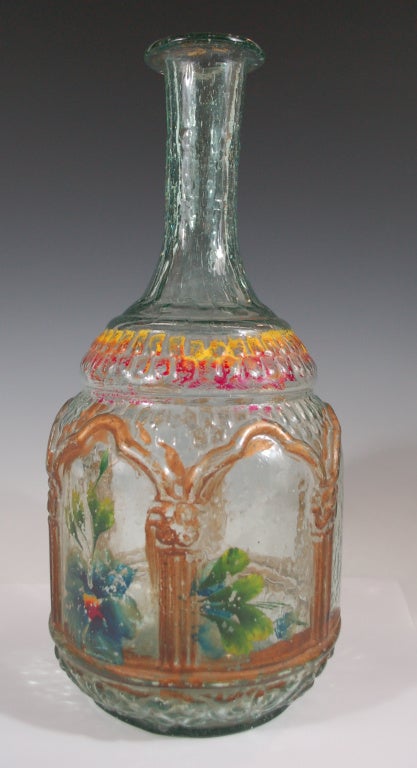 Rare collectible painted bottle from Puebla Mexico. Bottles like this were used for the storage of table wine, Mezcal, Tequila or pulque. The bottle has loss of paint expected with use and age of this piece.  This bottle is a unique find of