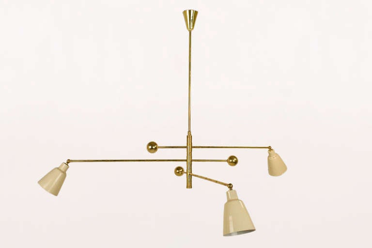 Triennale chandelier in the style of Angelo Lelli for Arredoluce, circa 1950, Italy
Brass and beige lacquered metal.
All the arms pivot with a sphere counterbalance and adjustable lacquered shades.