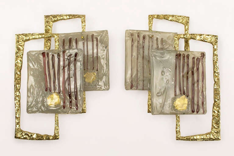Pair of sconces by Angelo Brotto, circa 1970, France.  Bronze and Murano glass.  Excellent vintage condition.