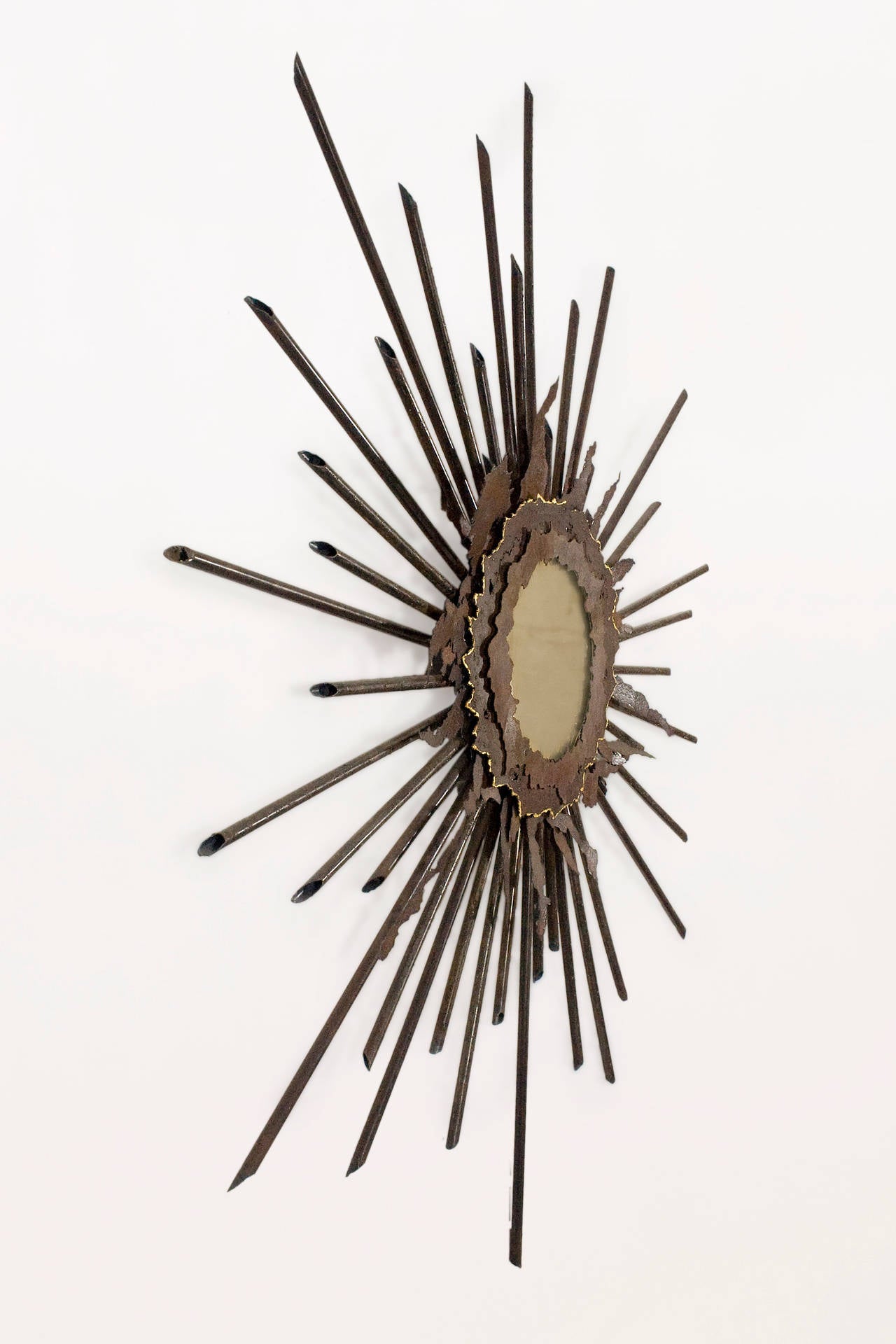 Brutalist Sunburst Mirror Made by the Legendary Laure Baudet
Forged & Cut Iron and Mirror
Circa 1990, France
Excellent Condition