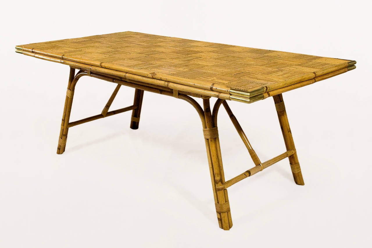 Bamboo and brass dining table.
Bamboo patchwork tabletop with brass corners.
Bamboo and brass,
France, circa 1970s.
Excellent condition.