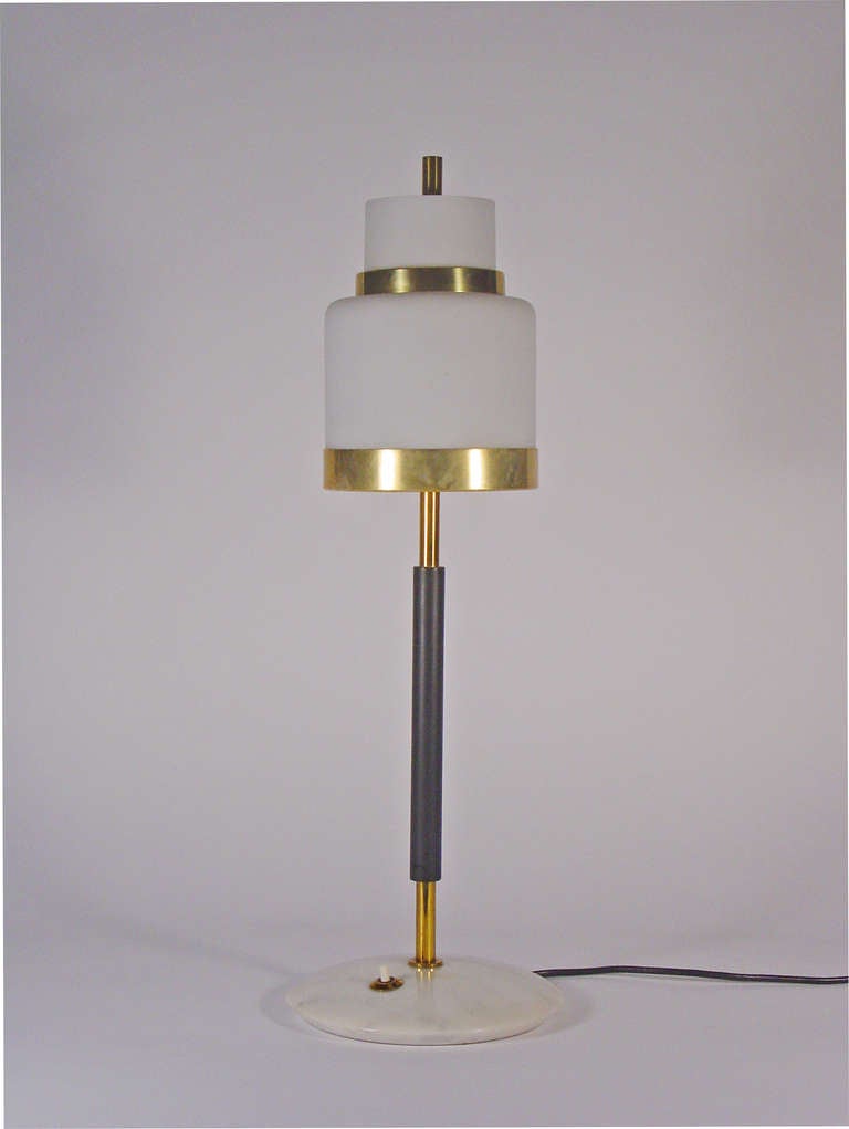 An exquisite Italian desk lamp.

The second brass ring as seen in the second image is the transparent lacquer which has aged, this can be easily cleaned to bring the brass patina to its' original state.

The piece is in an excellent state of