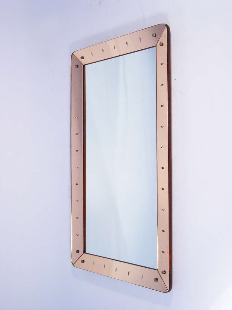 A stunning wall mirror in light pink/orange mirror frame
Italy 1940's