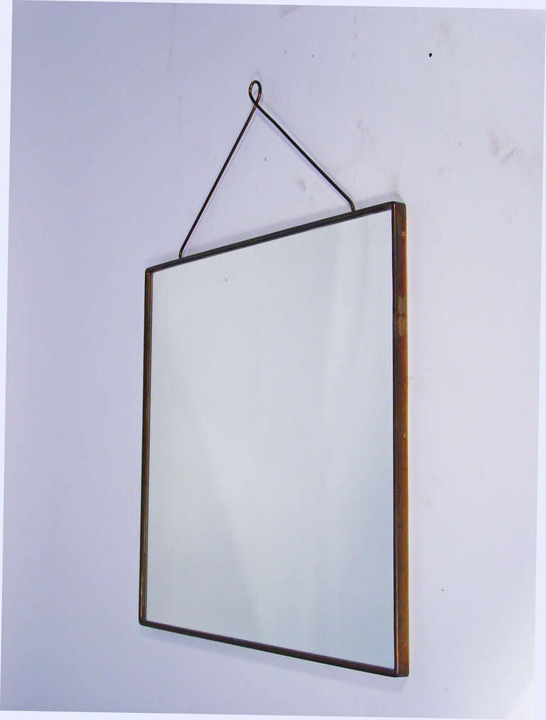 a beautifully crafted wall mirror in brass.
Italy 1940's
