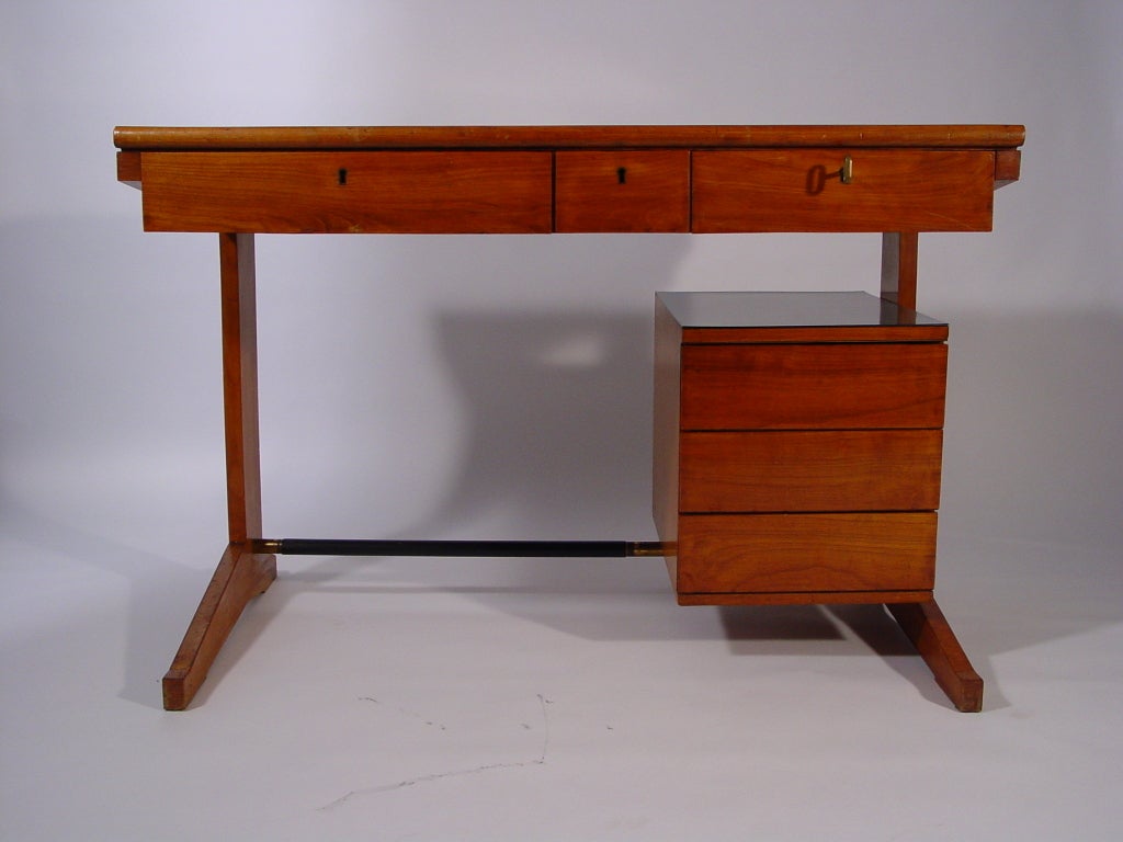 Exquisite craftsmanship desk, 
Attributed to Ignazio Gardella.
The desk has 3 side drawers and 3 drawers on the top. The top and drawers box are covered with a thick green linoleum.
