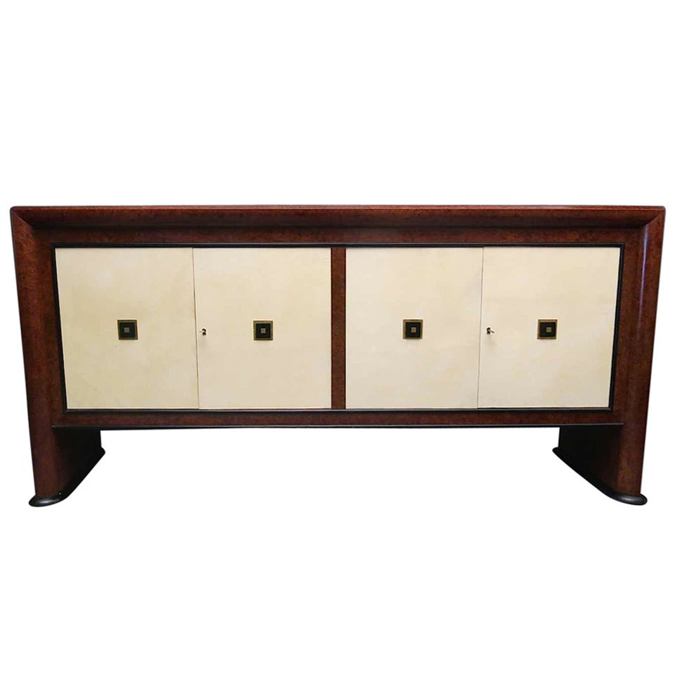 Italian Art Deco sideboards. Buffet sideboard, veneered in maple wood root. The buffet composed in four doors all covered in parchment. Rigorous its geometry, very squared and linear. Glass and brass inserts are placed in the centre of the doors.