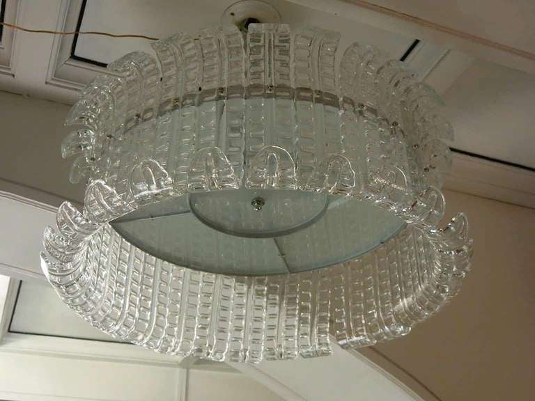 A beautiful chandelier with leaves all around to cover the circular structure. Very bright, very very delicious. In a beautiful entrance or over a nice dining table, visually unobtrusive, very bright.