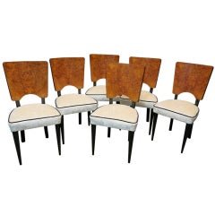 Six Chairs In Good Showing Around A Nice Table