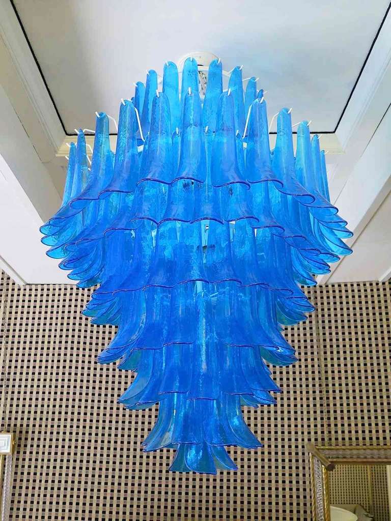 Mazzega 1970 Murano Chandeliers. These very special curved tiles that make up the chandelier. Its blue color is really guessed for a different and original chandelier from others. Chandelier composed of an iron structure of round shape, all around