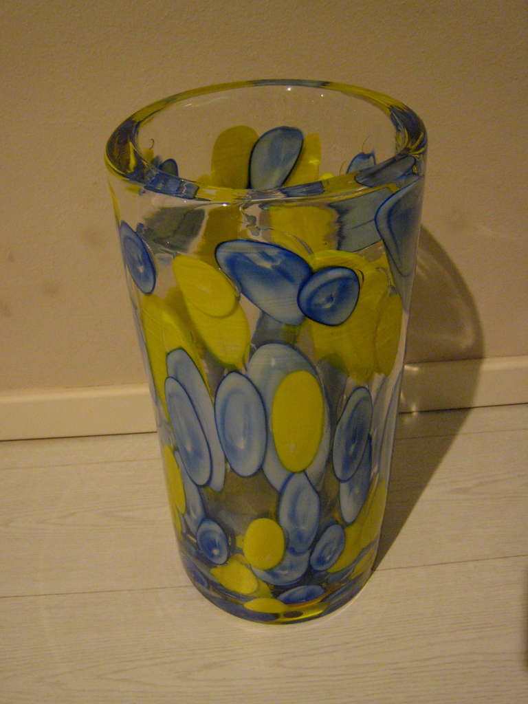 Transparent and thick blown glass with yellow and bleu 