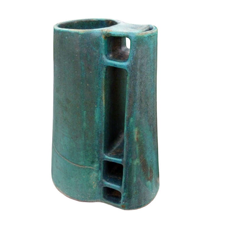 Heavy ceramic pitcher green, useful as decorative vase with original manufacturing defects, and very small chipping on the base. Marked manually with a symbol of the manufacturer.