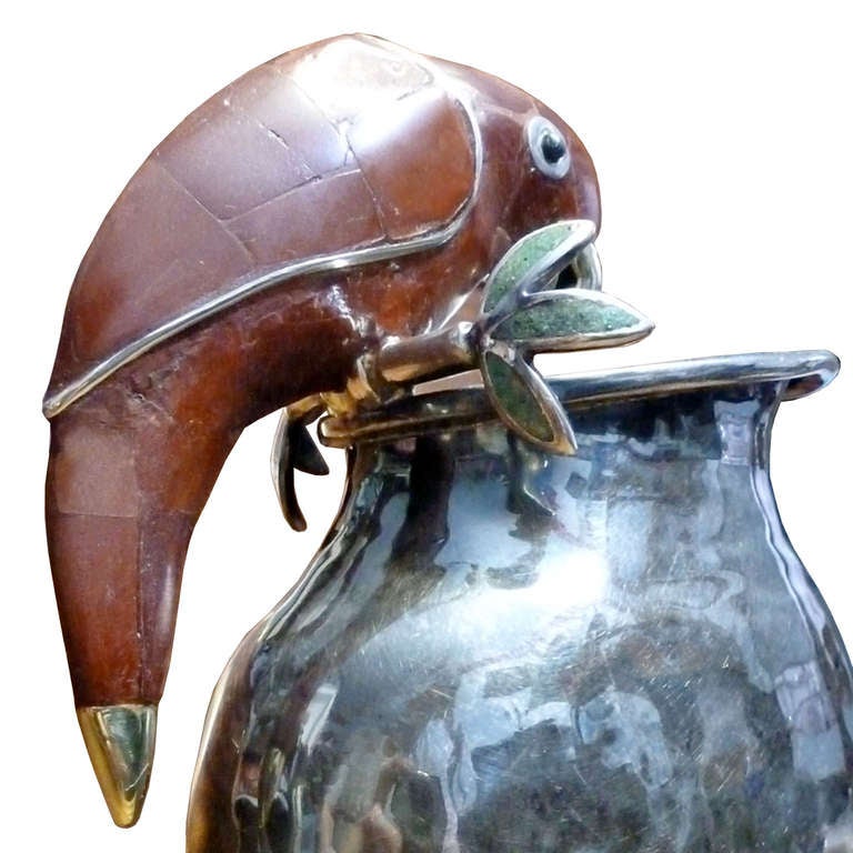 Following the tradition of the dynasty of Los Castillo , beautiful silver plate pitcher with red jasper parrot, hand-hammered pitcher.