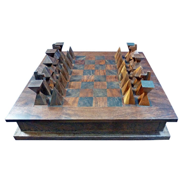 Chess Set with domino included, the case has the form of a book, made of ironwood, good condition with minimal details for the years of use.
Very heavy,  Modernist design of the sixties.
Don Shoemaker Style