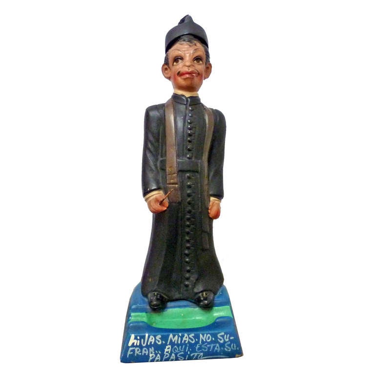 Cantinflas figure with ashtray of a Priest in decorated clay,  dedicated to Paco Malgesto, Malgesto was one of the most prominent radio and television host in México.
With folk legend at the base: My daughters do not suffer .. here's your