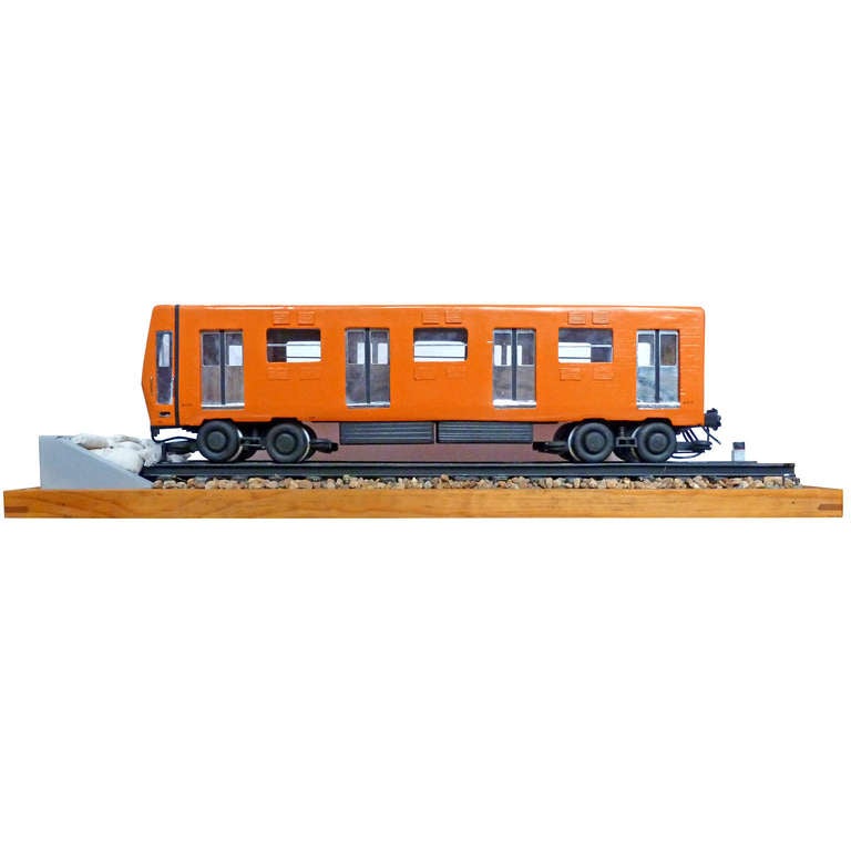 Scale model of a Mexican subway wagon, unique piece made ​​of wood, same that belonged to an engineer who was involved in the construction of the subway in Mexico City.
Wooden structure with acrylic case.