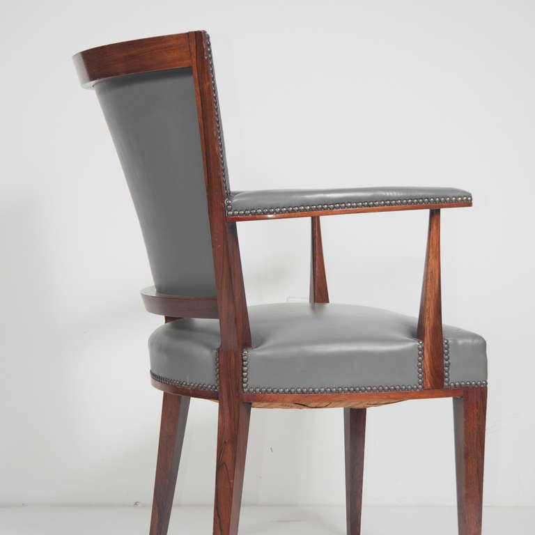 A set of faux leather (to be re-upholstered) rosewood chairs in the manner of 