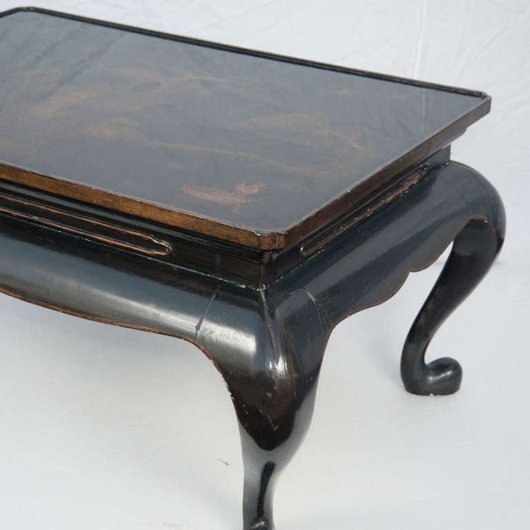 Chinoiserie side table with gold etching detail on top.