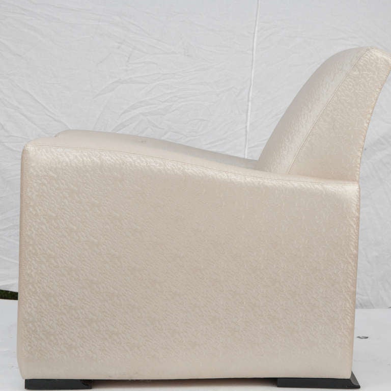 An Art Deco style upholstered club chair by Hugues Chevalier.