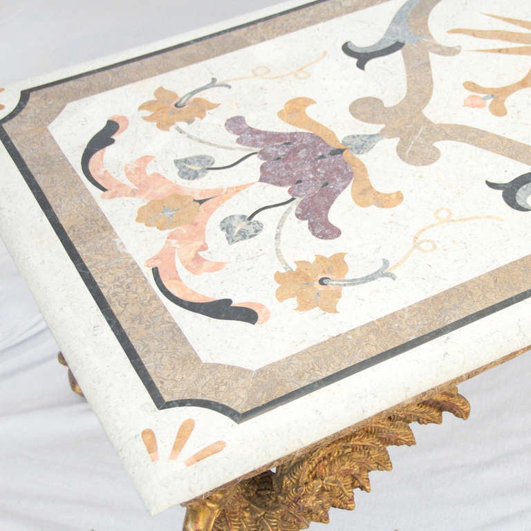 Beautiful inlaid marble top carried by 4 eagles with spread wings.