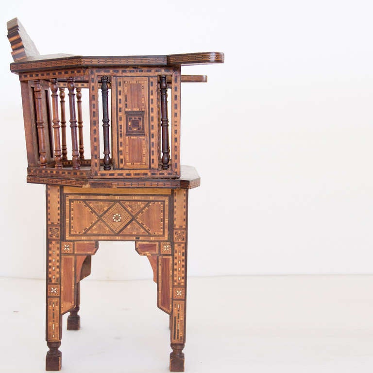A Syrian arm chair with mosaic inlay of mother of pearl.