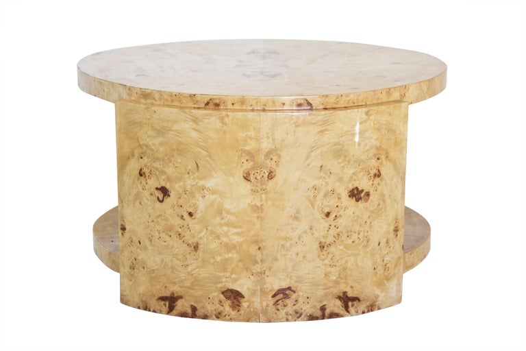 A round, 2 level side table in blonde burr wood.