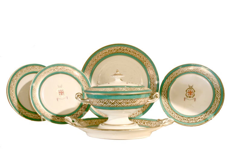 This set contains 1 soup tureen with cover and stand, 4 two-handled vegetable dishes with three covers and one tall serving dish, 2 sauce tureens with covers and stands, 2 gravy boats, 1 21