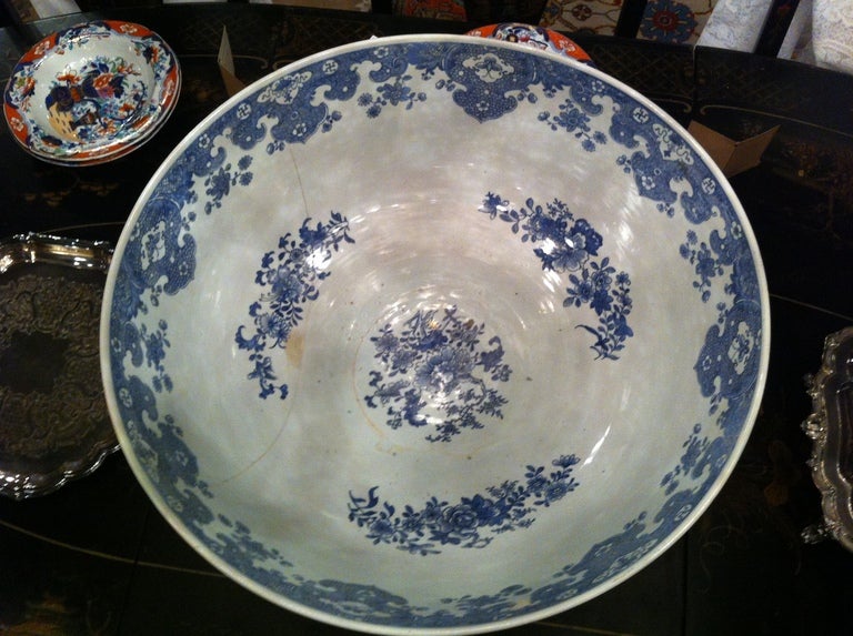 Large Chinese blue and white punch bowl with a repair.