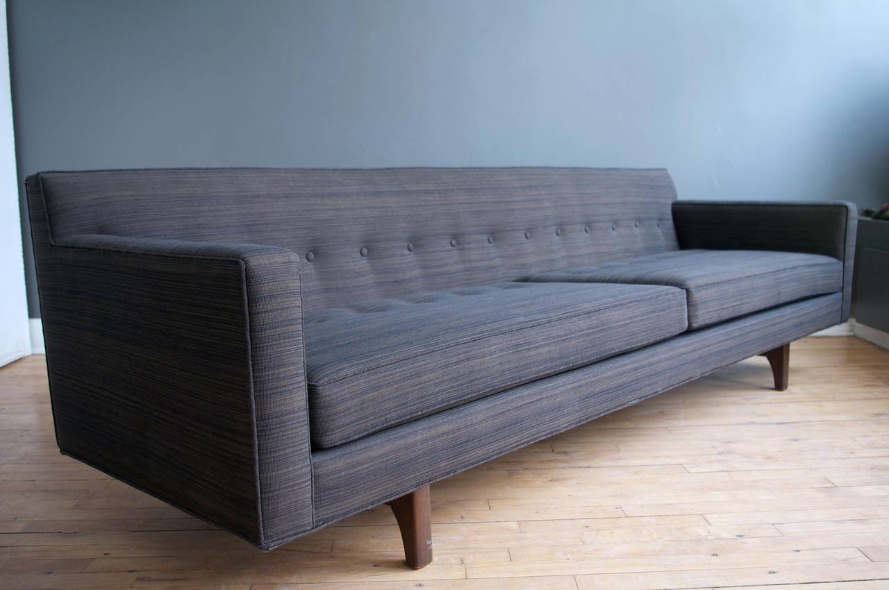 An elegant bracket back sofa designed by Edward Wormley for Dunbar, circa 1960.

Mahogany feet and bracket back are in excellent condition.