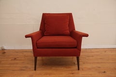 Orange Lounge Chair with Splayed Wood Legs 