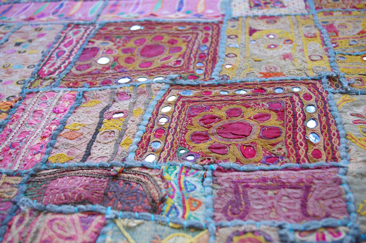 A large and colorful vintage embroidered patchwork spread from Gujarat, India.

Measures approximately 104
