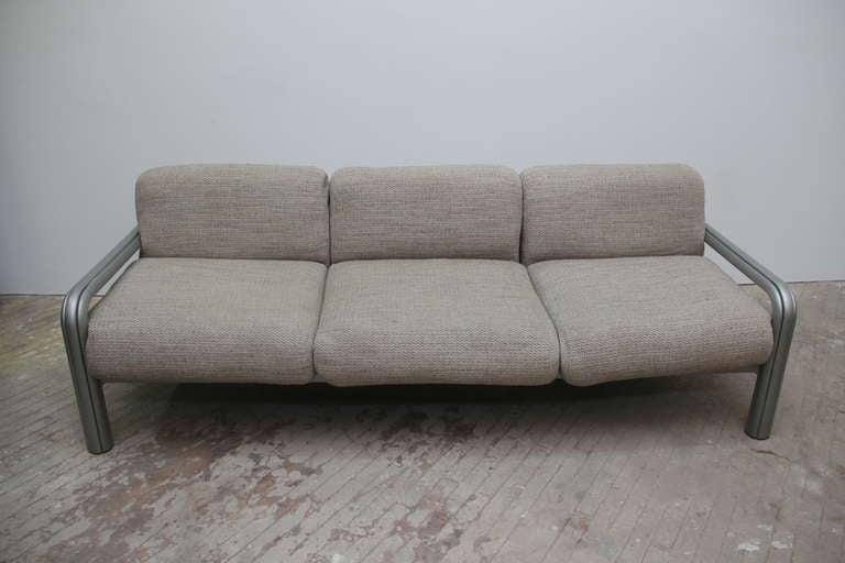 Italian designer Gae Aulenti created this sofa for Knoll. The frame is solid brushed steel, the upholstery and cushions are original.  This piece is rarely available in plain brushed steel - it is usually enameled.  