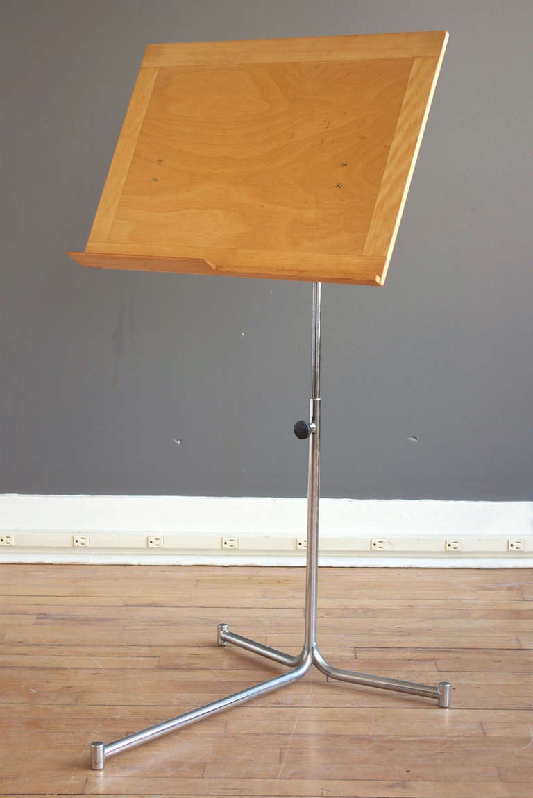 A rare adjustable reading stand by Bruno Mathsson, produced by Firma Karl Mathsson. Constructed of ash and birch with a cantelivered stand of nickel-plated steel. Originally designed to complement Mathsson's 
