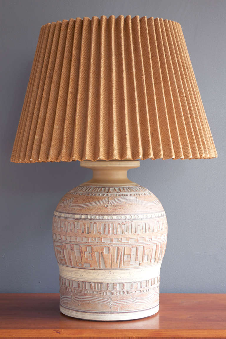 A large ceramic table lamp by Casual Lamps of California, circa 1980.

Original pleated burlap shade measures 22