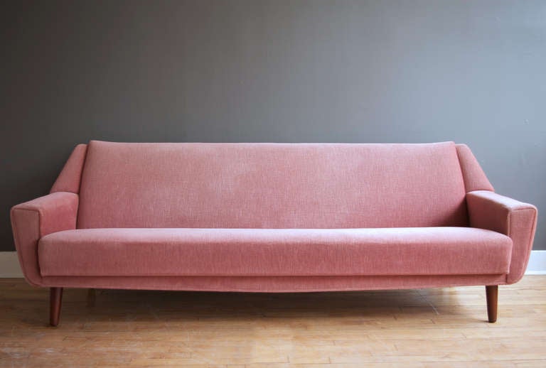 A Danish sofa in the style of Kurt Østervig, ca. 1950s. Original pink mohair upholstery is in near mint condition.