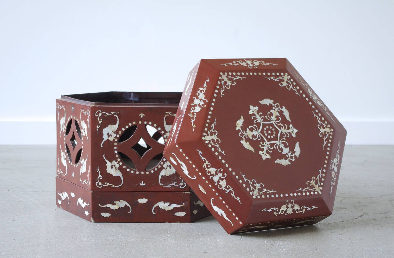 An antique Chinese red lacquer box inlaid with mother-of-pearl, circa 1910.