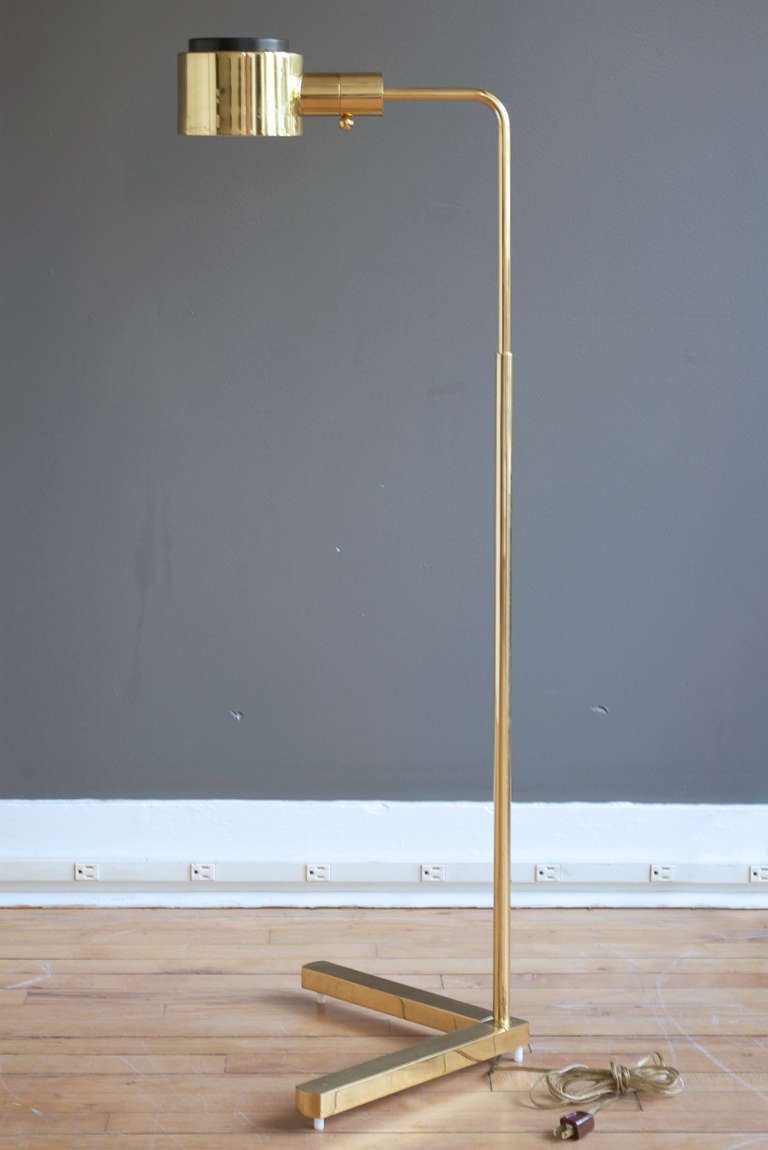 An adjustable polished brass floor lamp by Casella Lighting, circa 1970.

The height is adjustable from 34